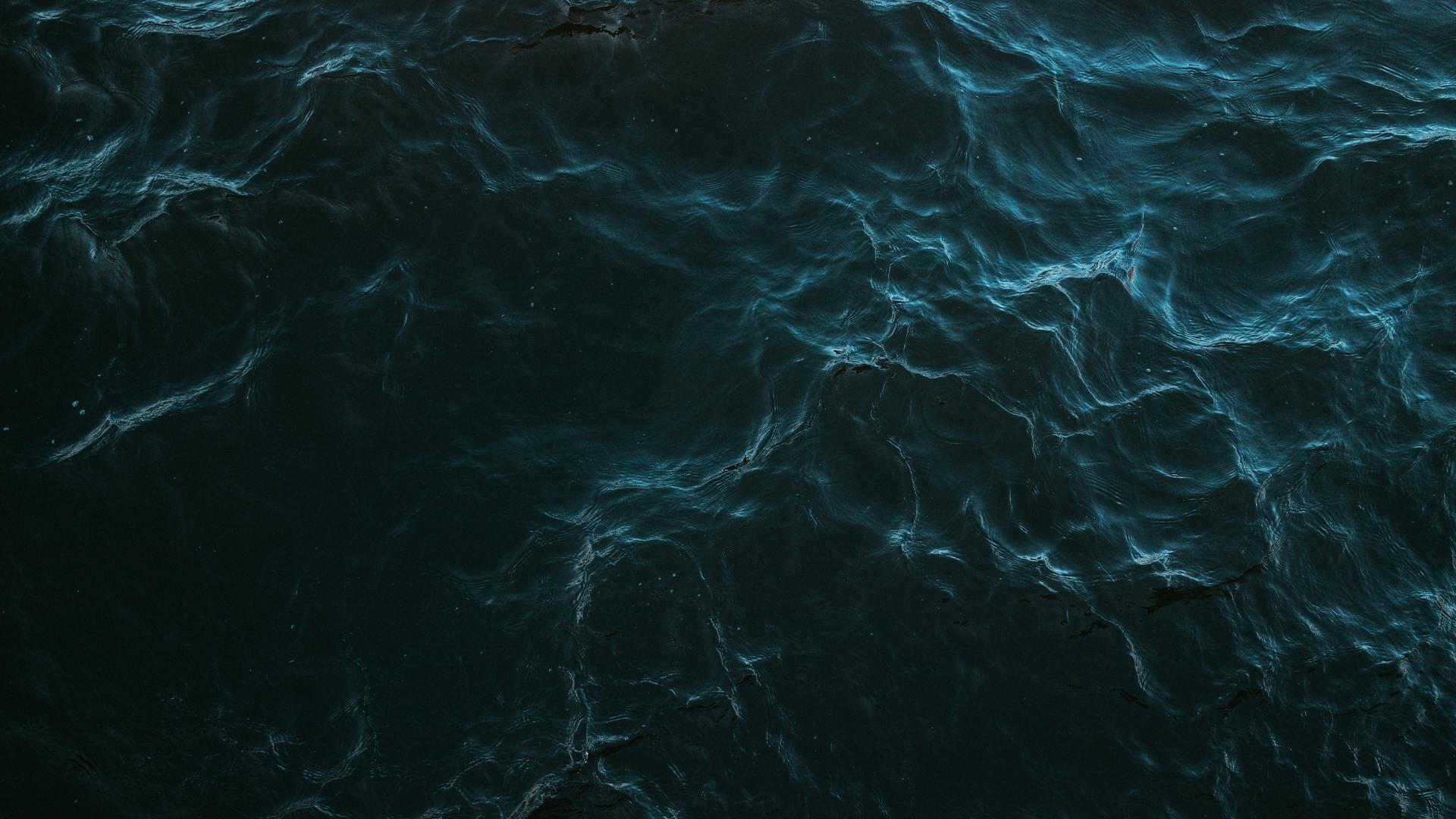 Dark water surface with ripples